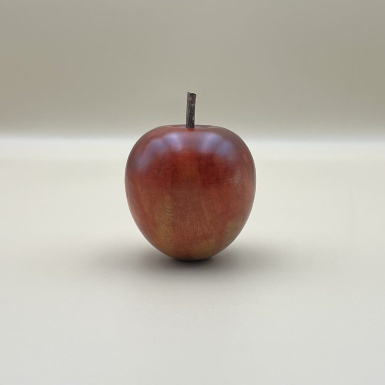 Hand painted wooden red apple with small brown stems.